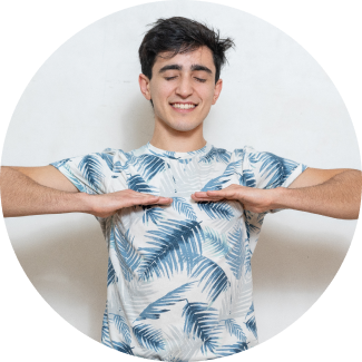 A smiling male with both his palms facing downwards performing breathing exercise